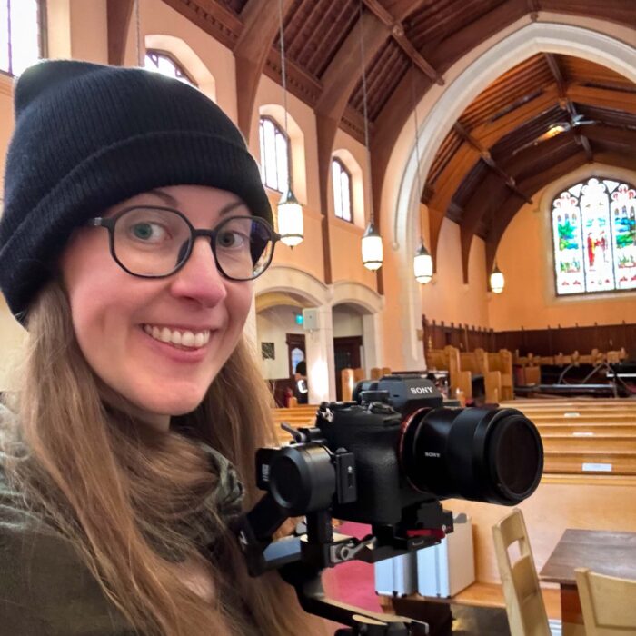 Jessica with video camera in a church